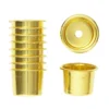 Ljushylsor, mässingsfärgade. Ø23 mm, H.20 mm (antikljus), tillverkade av aluminium