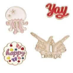 Pins, badges, 4 st. guldiga & färgglada små mini-broscher med attityd och en manet!
